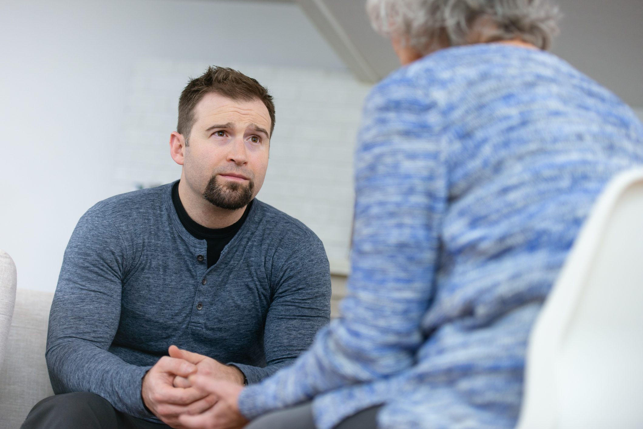 A man learns about the detox program while in therapy
